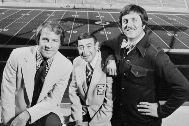 “Dandy Don” Meredith (right) is shown in 1973 with “Monday Night Football” cohosts Frank Gifford (left) Howard Cosell.
