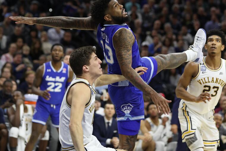 Collin Gillespie (front left) of Villanova and Myles Powell of Seton Hall collide during the first half.