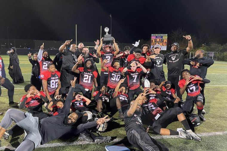 The undefeated Sharon Hill Ramblers celebrate after winning the IYFL Championship in West Chester on Nov. 5.