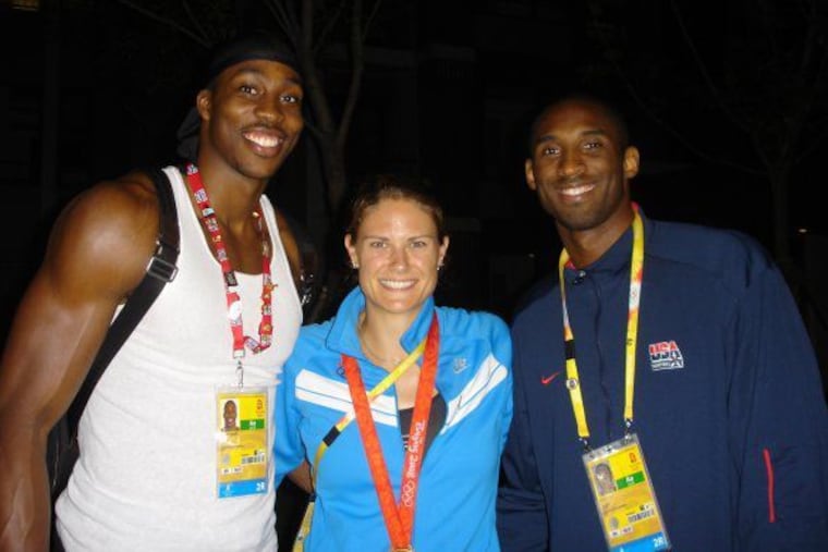 Dwight Howard (left) and Kobe Bryant (right) with Susan Francia after Francia won a gold medal in rowing at the 2008 Olympics in Beijing.