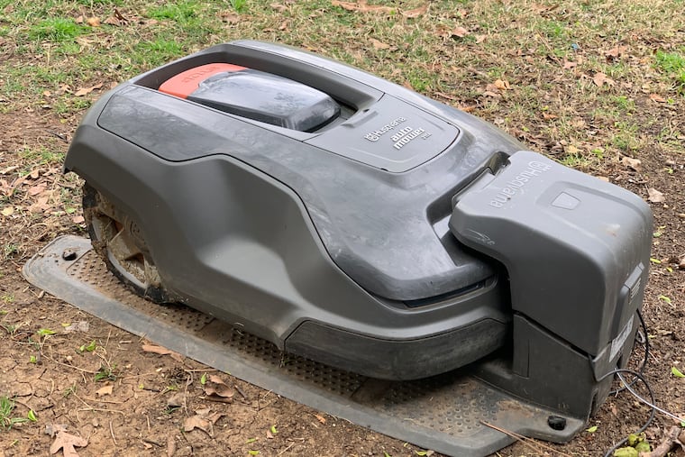 The Husqvarna Automower 315X in its charging base.