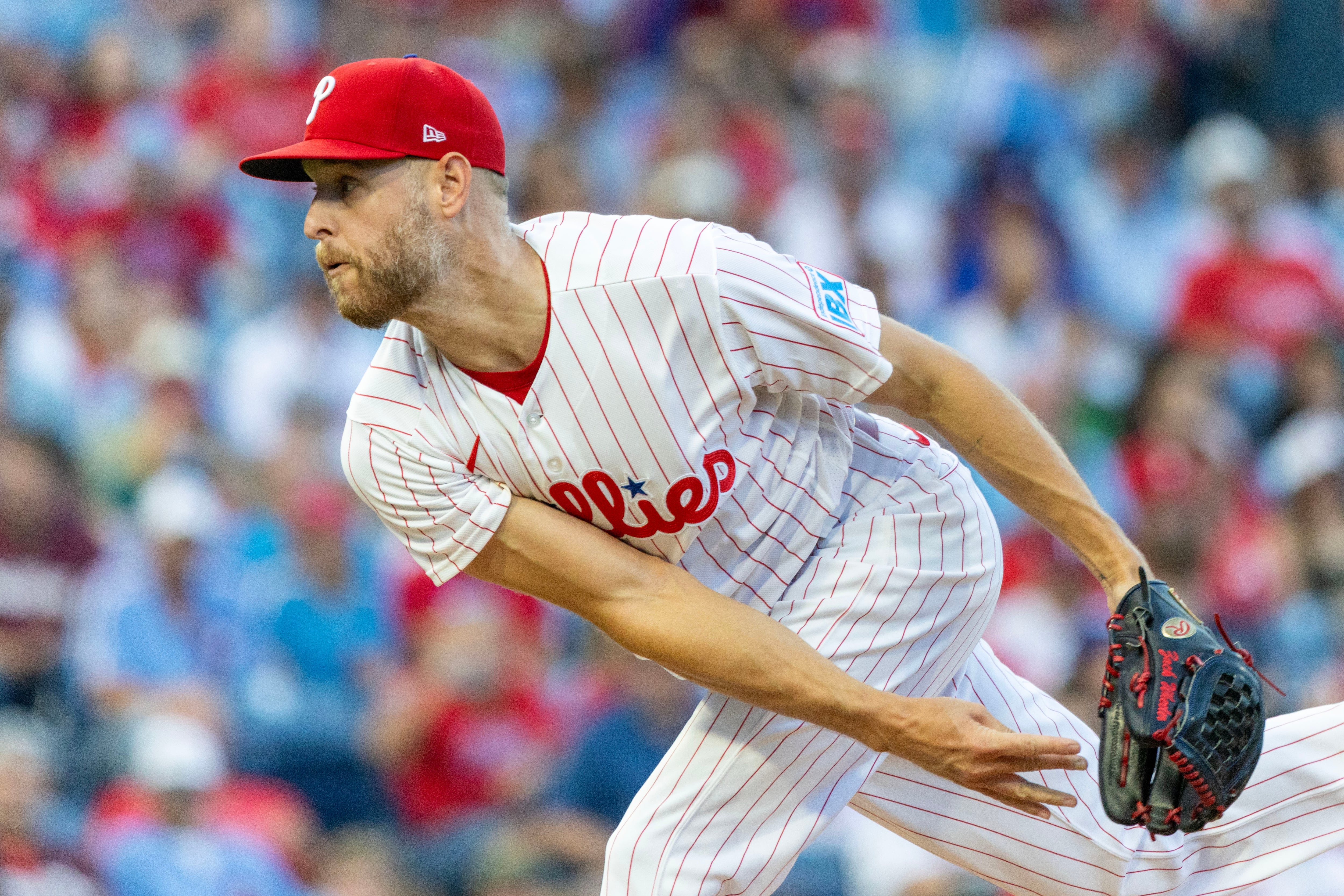 Wheeler fans 9 in 6 sharp innings, Schwarber hits 41st homer to lift Phillies past Braves 4-2