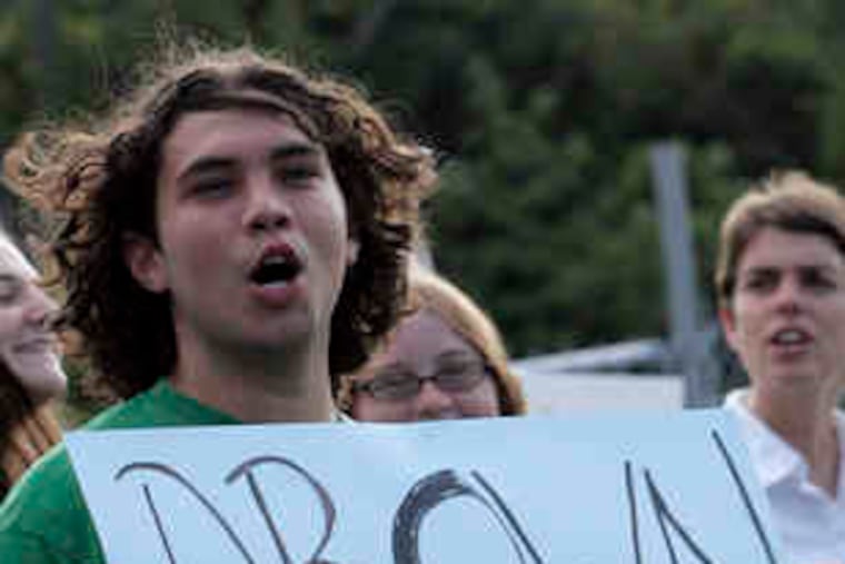 Frederico Maldonado and others gathered yesterday to protest alleged discrimination at the swim club in Huntingdon Valley.