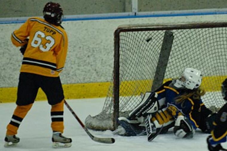 Unionville's Molly Tupp scores the winning goal in the third period over Down. East goalie Miranda Stueve. (Ron Tarver/Staff Photographer)