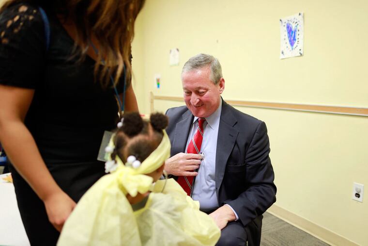 Jim Kenney, the Democratic nominee, play-acts with Laila Williams and her stethoscope at Spring Garden Academy. (DAVID SWANSON/Staff Photographer)