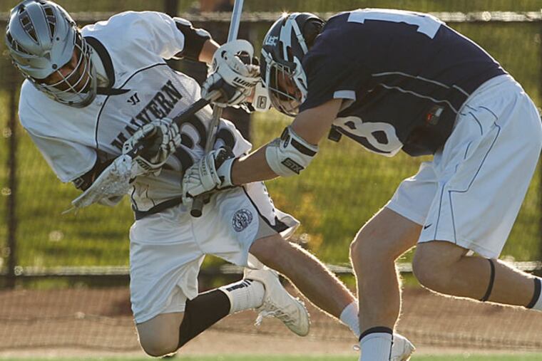 Episcopal Academy's Kevin Gayhardt shoves Malvern's
Eddie McLoughlin in an effort to get to the ball at Malvern High
School. (Ron Cortes/Staff Photographer)