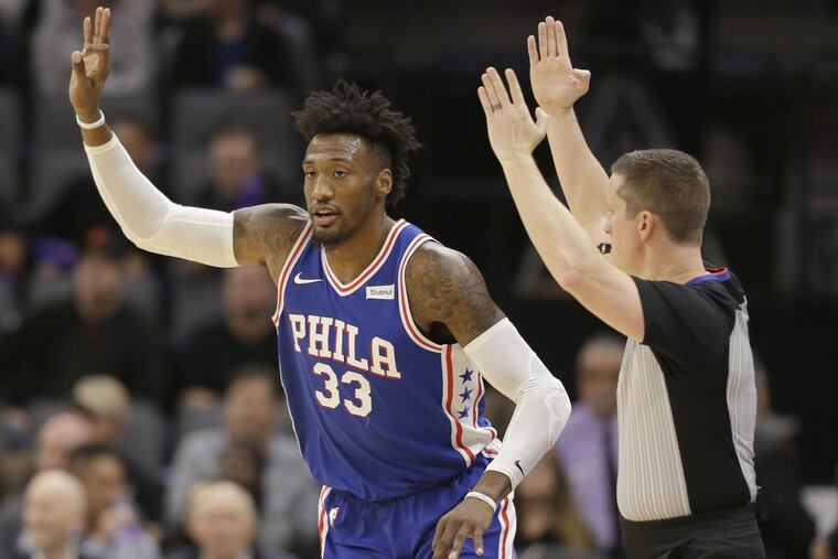 Sixers forward Robert Covington flashed three fingers after scoring from long range in the Sixers’ 109-108 loss to the Kings on Thursday.