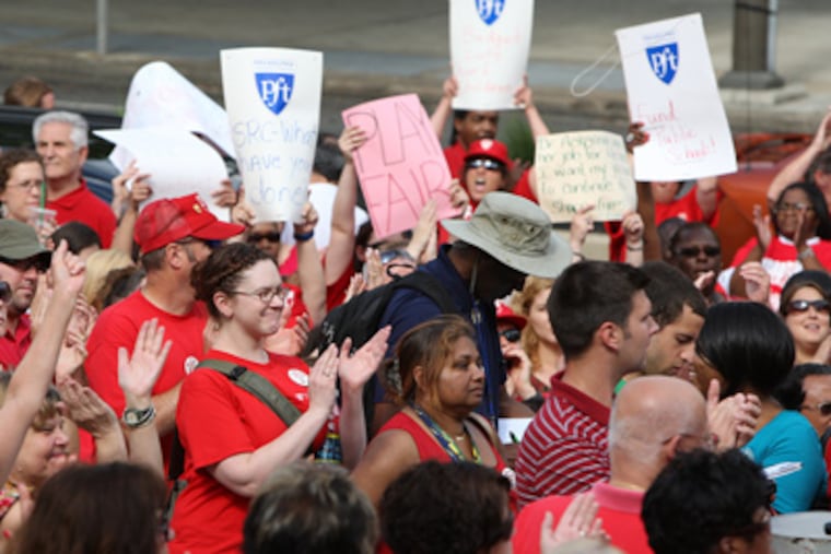 Hundreds of teachers, counselors, and others rallied Monday before the School Reform Commission meeting. (Steven M. Falk / Staff Photographer)