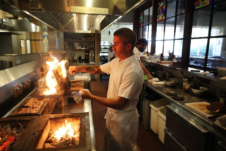 Michael Solomonov prepares the aged veal chop at Zahav.