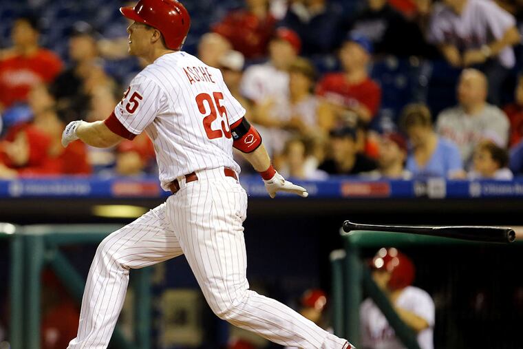 Phillies' Cody Asche watches his game winning two-run home run to beat the Chicago Cubs on Saturday, September 12, 2015 in Philadelphia.