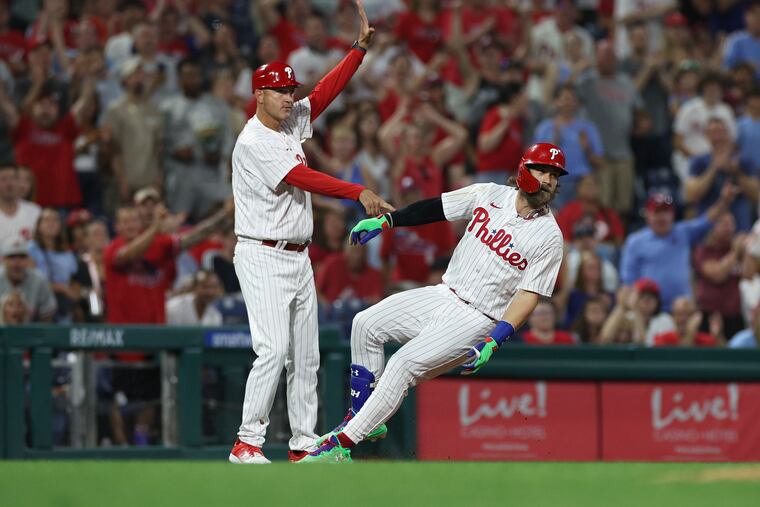Bryce Harper (right) has had two hits in each of the past four games since switching over to DH, including three home runs and a triple.
