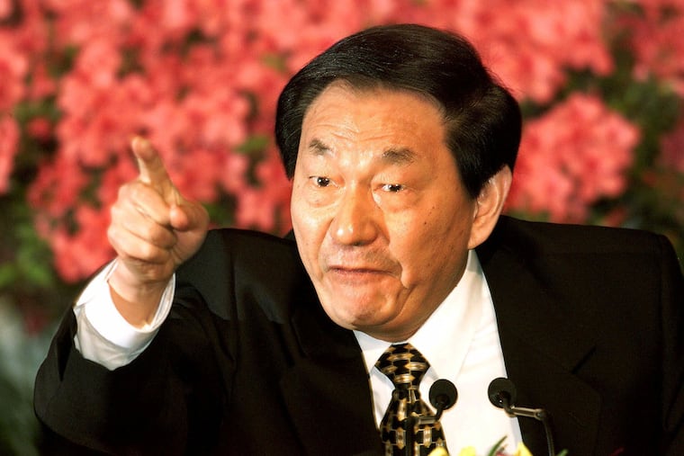 Chinese Premier Zhu Rongji speaks during a 2000 news conference in Beijing.