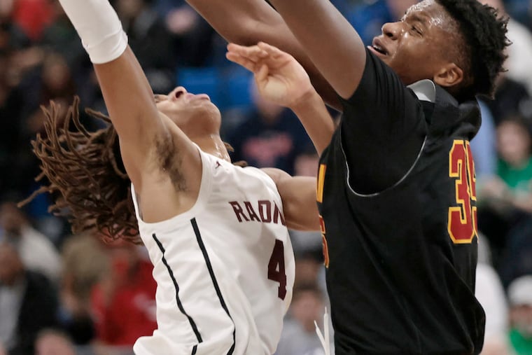 Archbishop Ryan's Thomas Sorber (right) blocks a shot by Radnor's Charles Thornton on Friday.