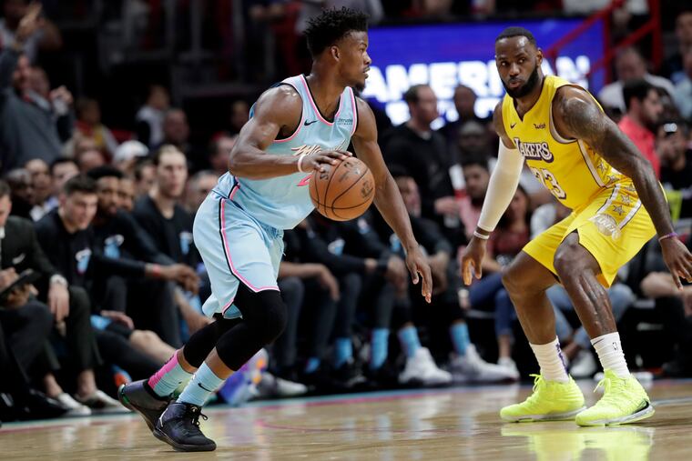 Miami Heat forward Jimmy Butler, left,