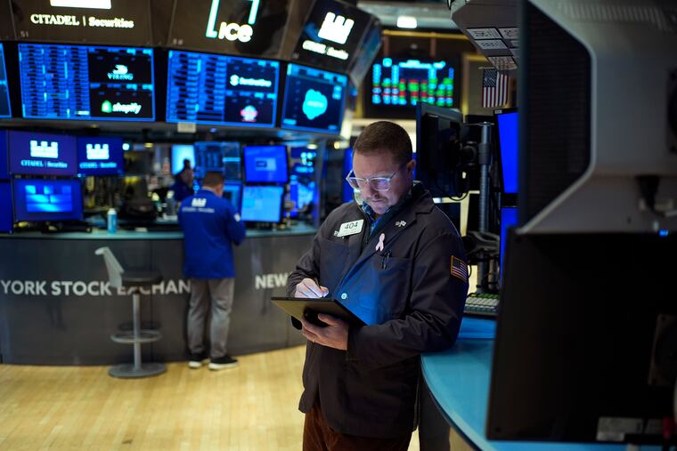 Traders work on the floor at the New York Stock Exchange on Wednesday, Jan. 29, 2025.
