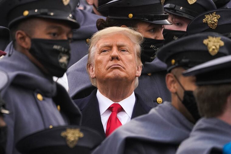 Surrounded by Army cadets, President Donald Trump watches the first half of the 121st Army-Navy Football Game in Michie Stadium at the United States Military Academy on Dec. 12, 2020, in West Point, N.Y.