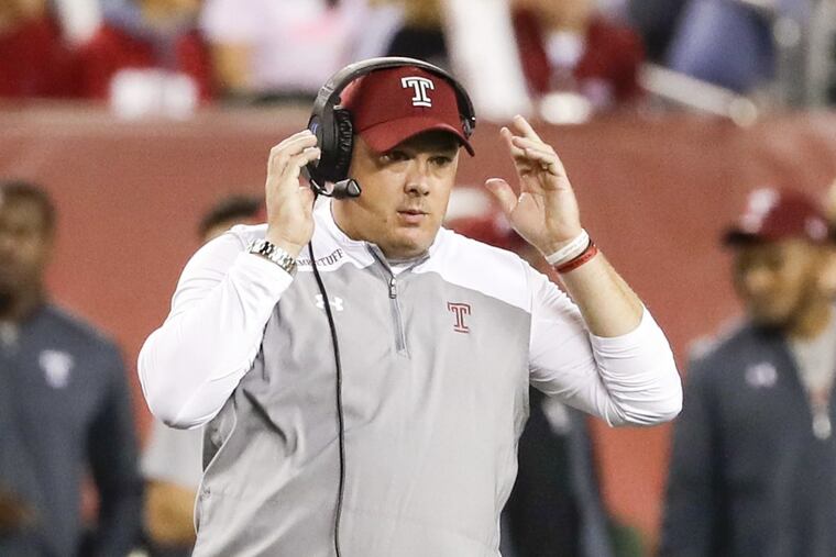 Temple coach Geoff Collins adjusts his headset during Thursday’s game vs. Navy.