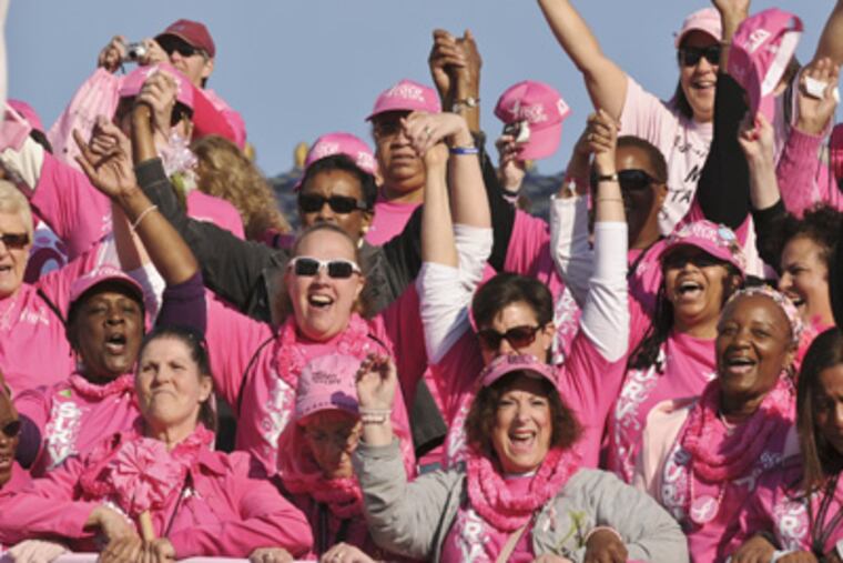 Some of the thousands of breast cancer survivors during the "March of Survivors" down the Art Museum steps at the start of the Susan G. Komen Race for the Cure. (Ron Tarver / Staff Photographer)