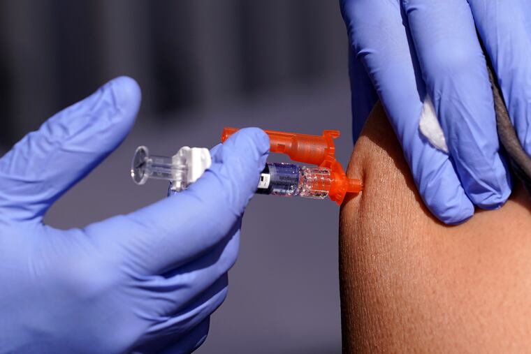 A patient is given a flu vaccine in 2022.