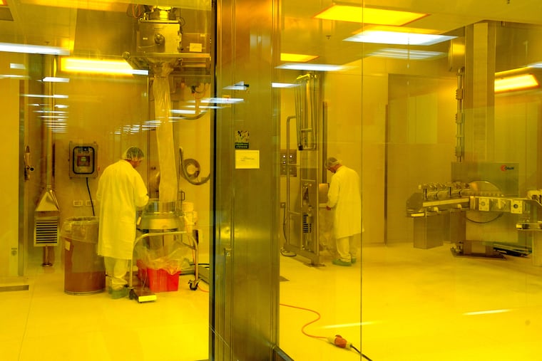 Workers check pharmaceutical products during the production process at Teva Pharmaceutical Industries factory in Petah Tikva, Israel. In a court filing, Teva said allegations of a price-fixing conspiracy "conclusory and devoid of any facts."