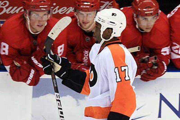 A fan threw a banana at Wayne Simmonds during his shootout attempt against the Red Wings. (Dave Chidley/AP)