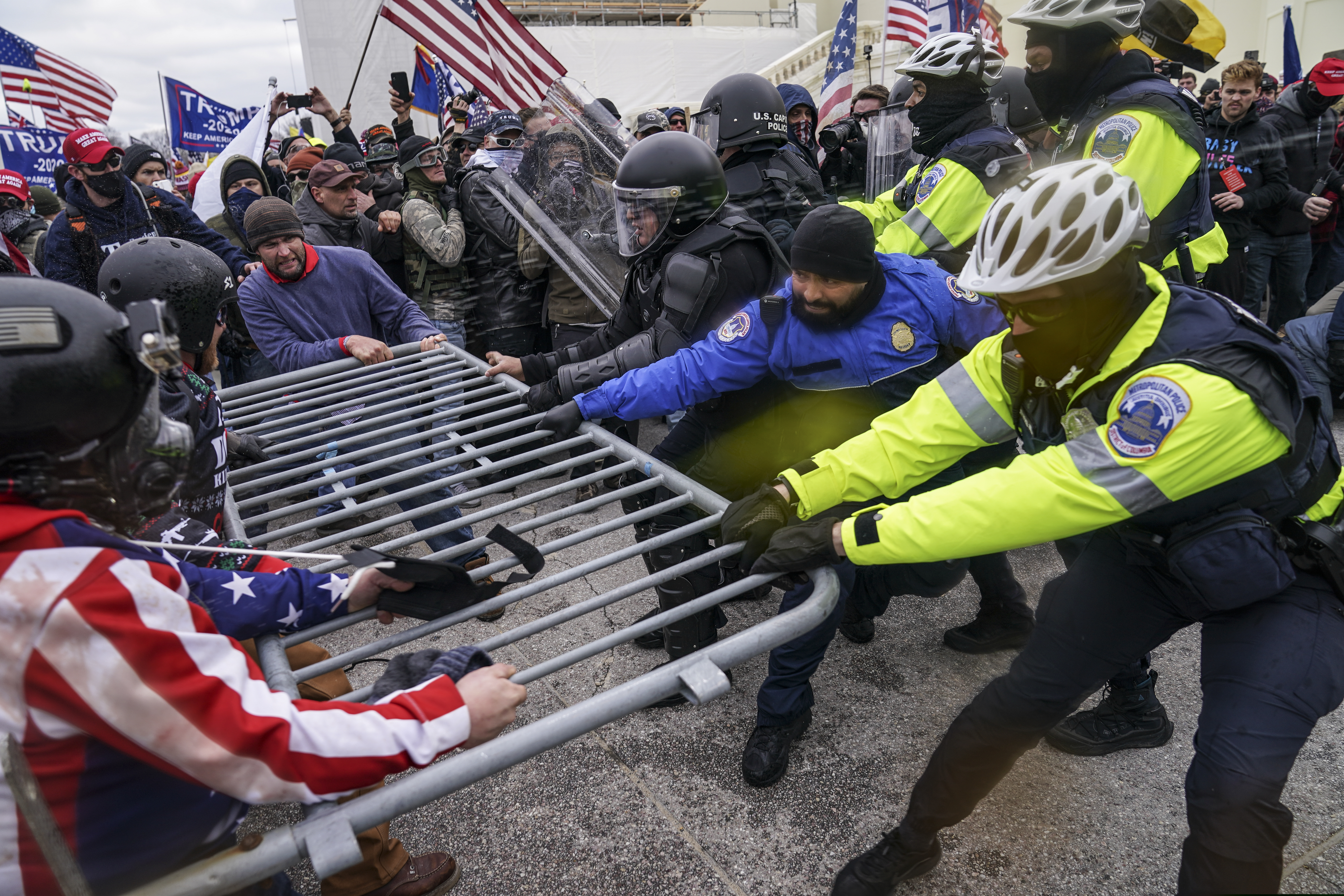 Trump supporters try to break through a police barrier Wednesday at the U.S. Capitol in Washington.
