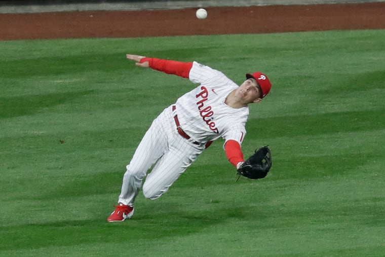 Phillies center fielder Mickey Moniak falls down as he catches a fly ball in the second inning Monday night at Citizens Bank Park.