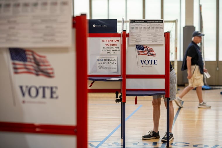 People cast their votes in the D.C. primary election this month. President Donald Trump is trying multiple methods to change voting rules before the midterms.
