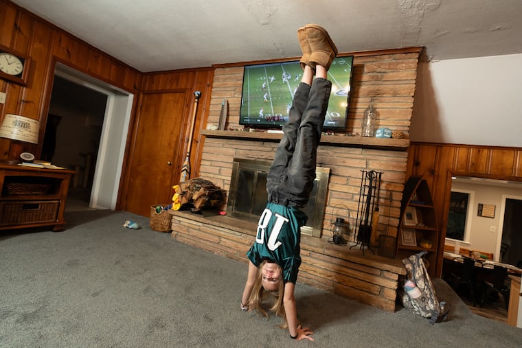 Being a kid who is an Eagles fan isn't as painful as it used to be. Here Rosey Asztalos, 11, does a cartwheel in her home in New Jersey.