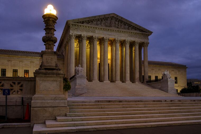 FILE - In this Oct. 5, 2018, file photo, the U. S. Supreme Court building stands quietly before dawn in Washington. The Constitution says you can’t be tried twice for the same offense. And yet Terance Gamble is sitting in prison today because he was prosecuted separately by Alabama and the federal government for having a gun after an earlier robbery conviction. he Supreme Court is considering Gamble’s case Thursday, Dec. 6, and the outcome could have a spillover effect on the investigation into Russian meddling in the 2016 election. (AP Photo/J. David Ake, File)