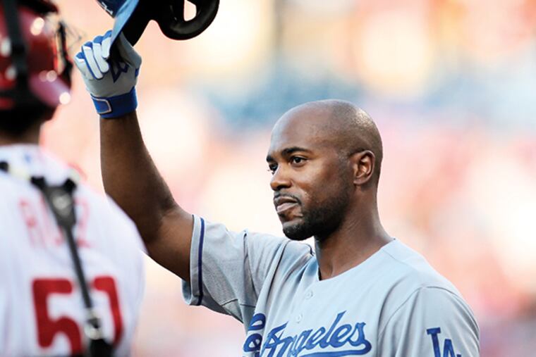 Former Phillie Dodgers' Jimmy Rollins tips his helmet to the fans before his first at-bat during the 1st inning at Citizens Bank Park in Philadelphia, Tuesday, August 4, 2015.