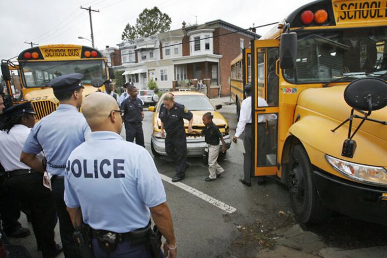 After the collision, students are unloaded from the bus. Six students were taken to Children's Hospital of Philadelphia for treatment of bumps and bruises.
