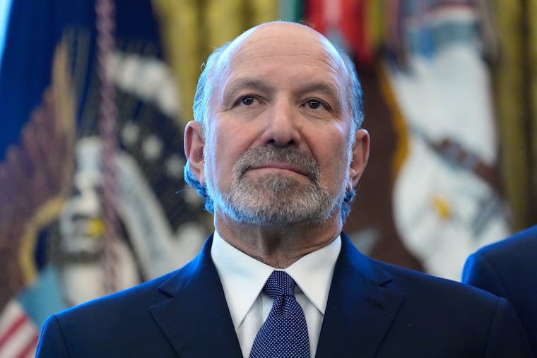 Commerce Secretary Howard Lutnick listens during an event with President Donald Trump in the Oval Office of the White House, Monday, Feb. 2, 2026, in Washington. (AP Photo/Alex Brandon)