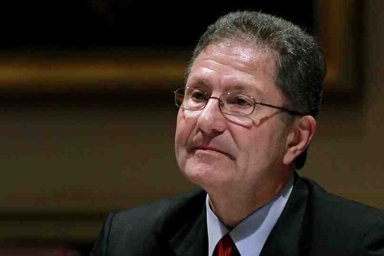 Richard McCormick at the news conference where he announced his plan to resign.