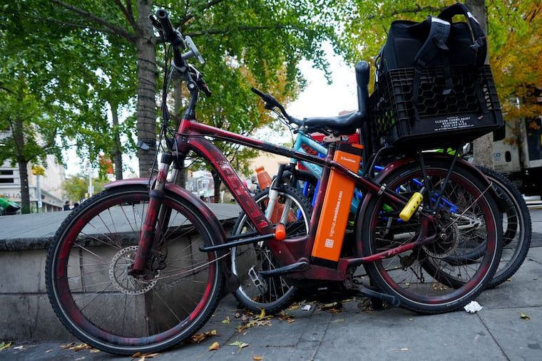 E-bikes are shown locked up by Grove Street PATH, Wednesday, October 29, 2025, in Jersey City.