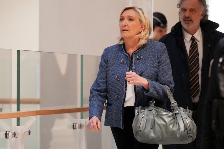 French far-right leader Marine Le Pen arrives at a Paris court on Monday, March 31, 2025.