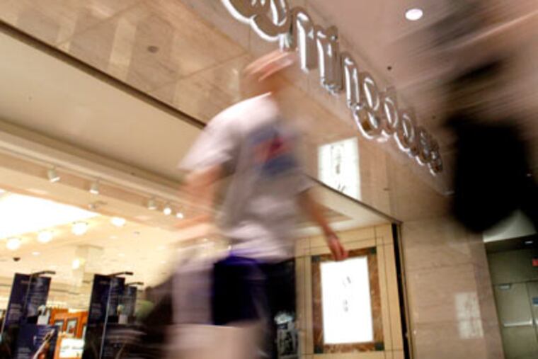 Shoppers walked out of Bloomingdale's at the Mall of America Wednesday, Jan. 4, 2012 in Bloomington, Minn. One of the Mall of America's original anchor stores is closing. Macy's Inc. announced Wednesday it plans to close the Bloomingdale's at the Bloomington mall early this spring. It's one of four Bloomingdale's around the country that are closing because of what the company calls underperformance. (AP Photo/The Star Tribune, Carlos Gonzalez)