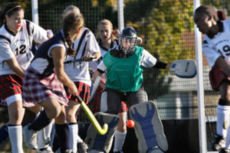Cardinal O'Hara's Alicia Govannicci fires on Northeast goalie Erin Null during their District 12 title game. Govannicci scored one of the Lions' four goals. O'Hara will next face Wissahickon.