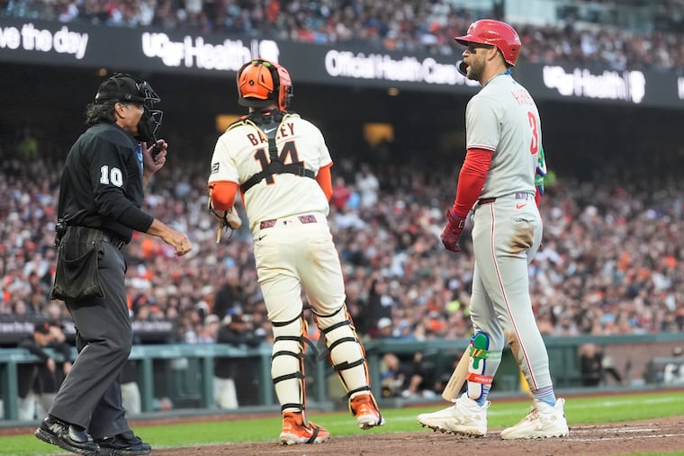 The Phillies' Bryce Harper reacts after being called out on strikes by umpire Phil Cuzzi during the fifth inning Monday.
