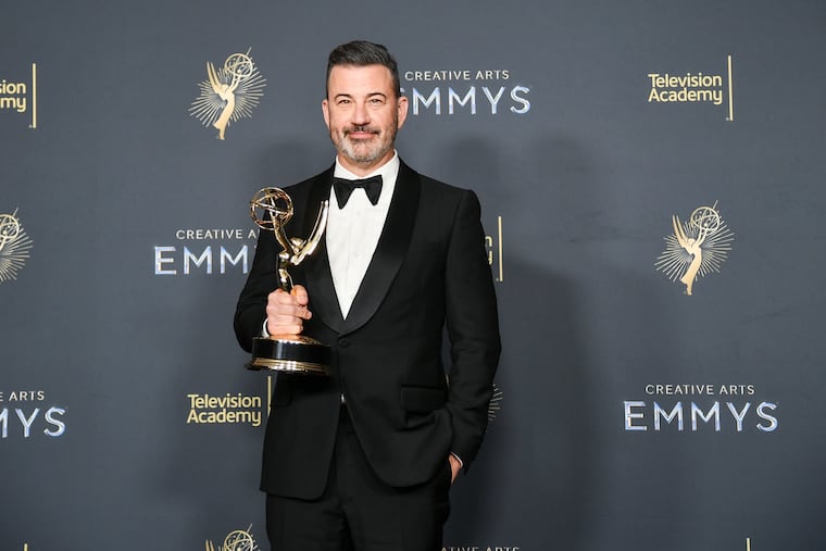 Jimmy Kimmel poses in the press room with the award for host for a game show for "Who Wants to Be a Millionaire" during night two of the Creative Arts Emmy Awards earlier this month at the Peacock Theater in Los Angeles.