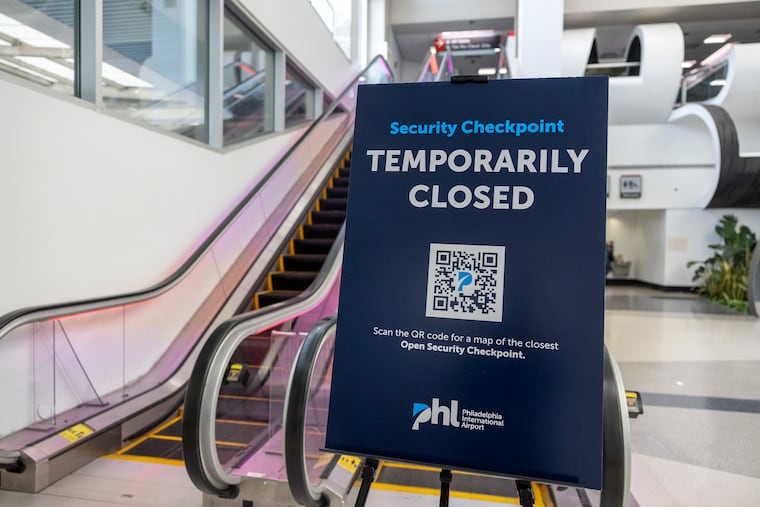 Sign telling travelers that a TSA checkpoint is temporarily closed at Philadelphia International Airport last month.