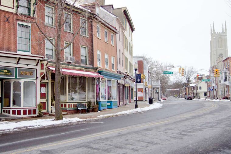 New stores and restaurants share space with bail-bonds services, law offices, and a drug-rehabilitation center in Mount Holly's business district.