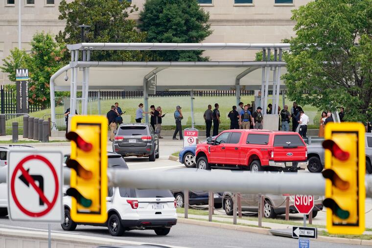 Police vehicles are seen outside the Pentagon Metro area Tuesday.