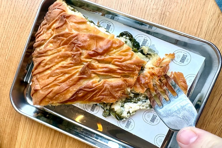 An imported spinach pie made by Rodoula in Athens, this one stuffed with extra feta, is warmed to a crisp and served at Madis Coffee Roasters locations across Philadelphia.