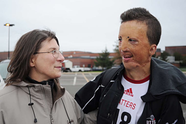 Sean Capena and mom, Adriana, after soccer game yesterday. (Sarah J. Glover/ Staff Photographer)