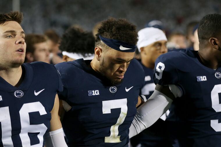 Koa Farmer (center) has seen his playing time decrease as a result of helping fellow Californian Micah Parsons grow.
