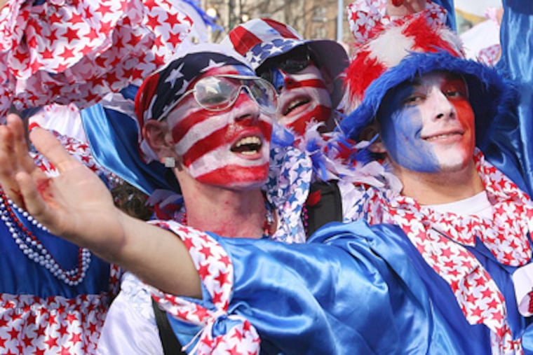Elaborate costumes, like this on Hog Island’s Eddie Pratt, right, might have to go by the wayside in the new Mummers fiscal atmosphere. (Jessica Griffin / Staff Photographer)