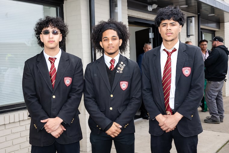 Camden Academy Charter High School students (from left) Angel Lagares, Geury Castellanos, and Benjamin Muniz are learning carpentry and other skills as interns at St. Joseph's Carpenter Society's new workforce training center in East Camden.