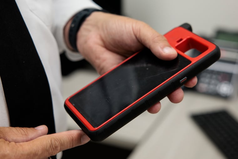 Lt. Brian Geer talks about key fob programmers at the Philadelphia Police Tow Squad.