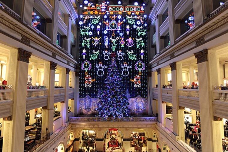 The Macy's Christmas Light Show lights up the Grand Court at the Macy's Center City on Saturday, Nov. 23, 2013 in Philadelphia. The Macy's Center City Christmas Window was also unveiled. (Michael Perez / AP Images for Macy's)